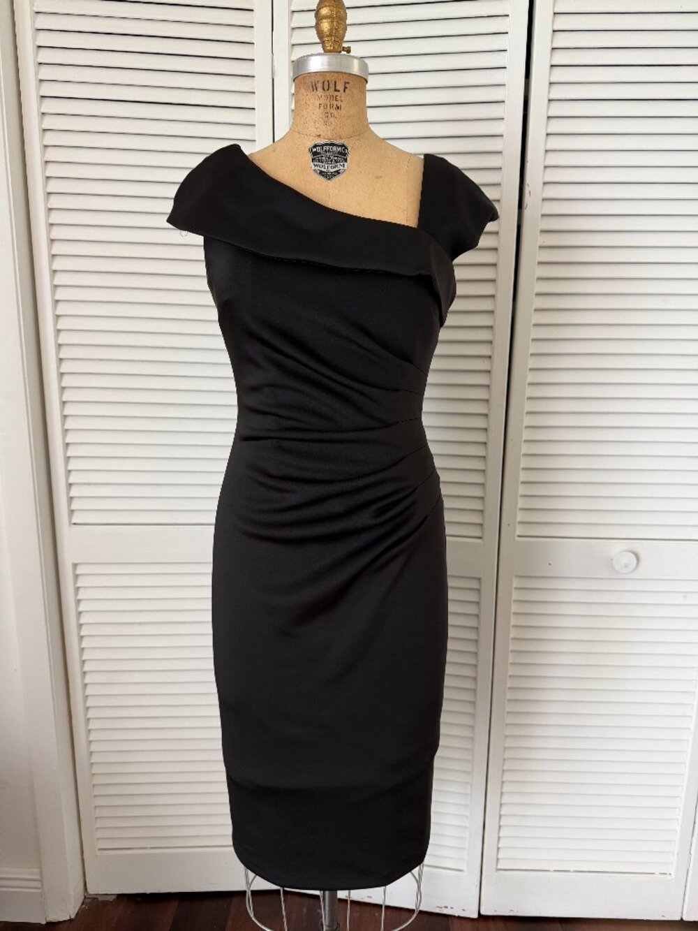Sleeveless, formfitting black dress